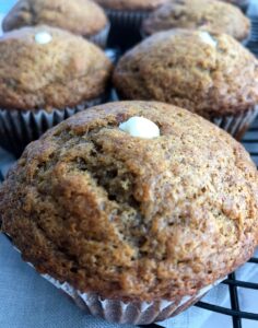 banana muffin with cream cheese piped into the middle