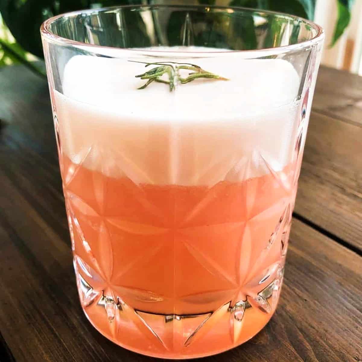 rosemary grapefruit vodka cocktail in a low ball