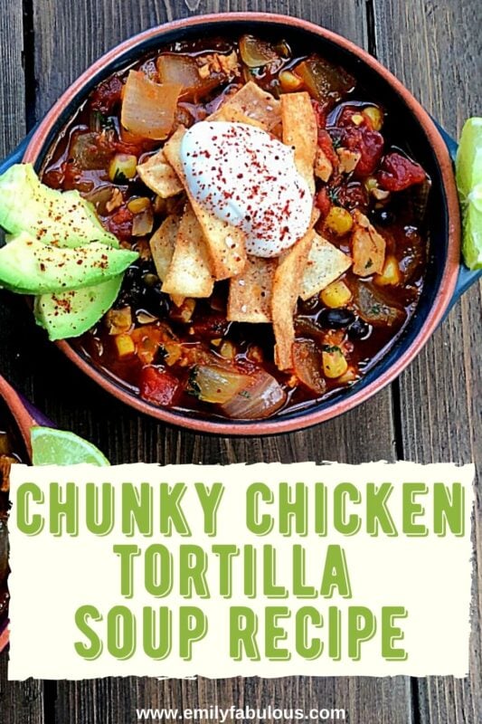 a bowl of chunky chicken tortilla soup with sour cream