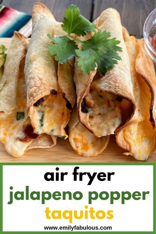 a stack of air fryer jalapeno popper taquitos on a wooden board with a cilantro garnish