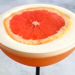 pisco sour with grapefruit juice and foam on top