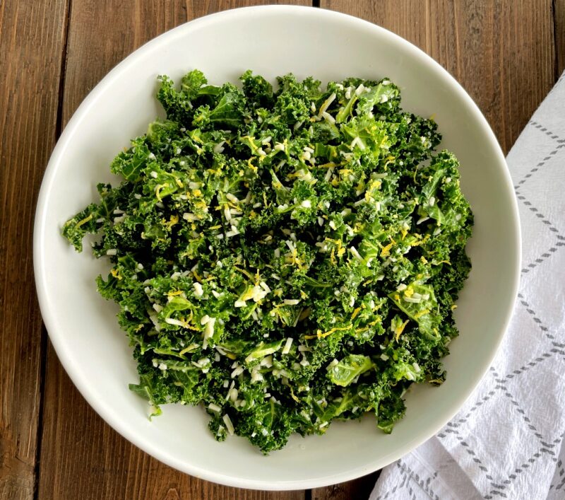 kale parmesan and lemon salad in a bowl on a table