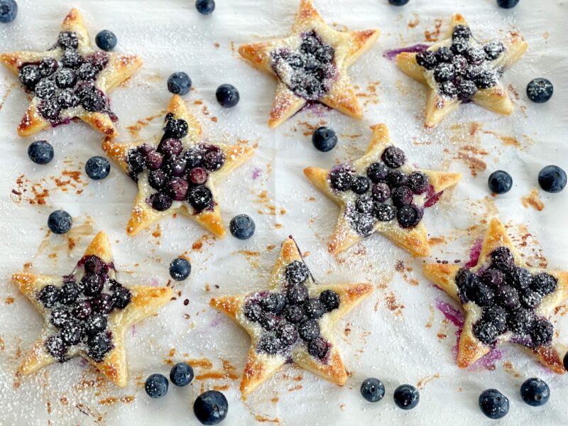 baked blueberry stars with powdered sugar on top