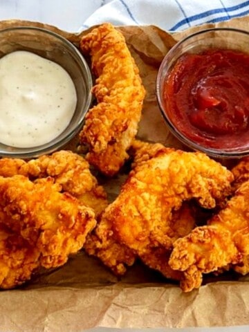 chicken-strips-on-a-tray-with-ranch-and-ketchup