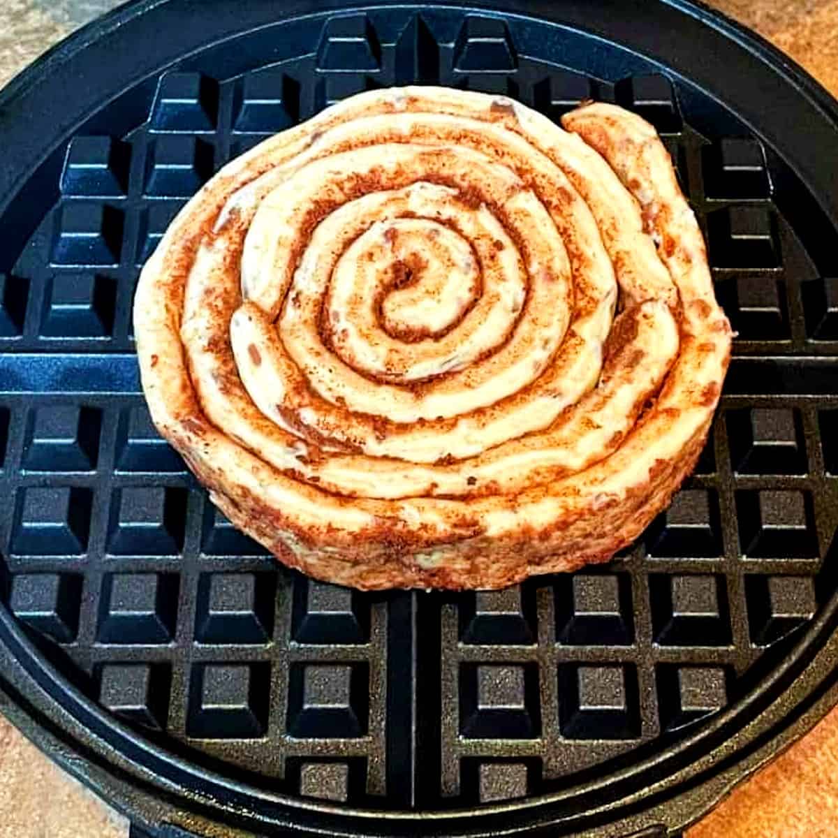 cinnamon-roll-in-a-waffle-maker-before-cooking