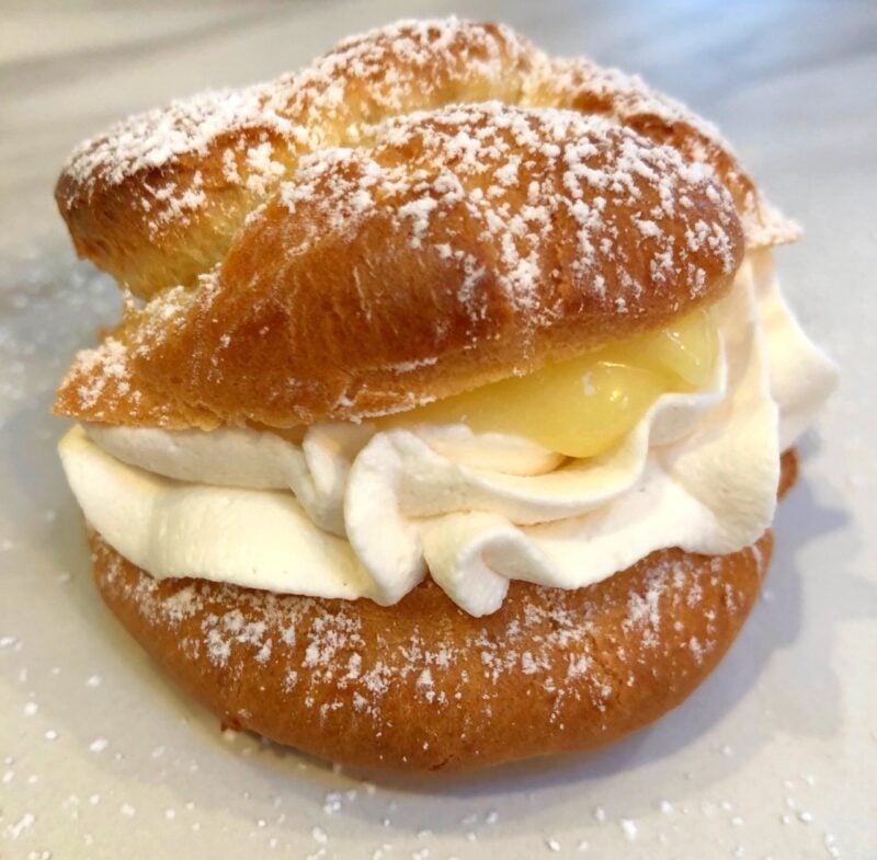 lemon cream puff with whipped cream and Meyer lemon curd inside.