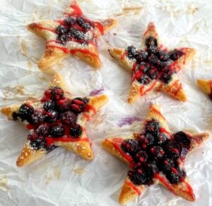 puff pastry stars with blueberries and red icing
