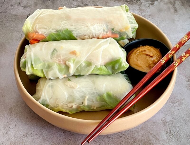 spring rolls with peanut sauce on a plate