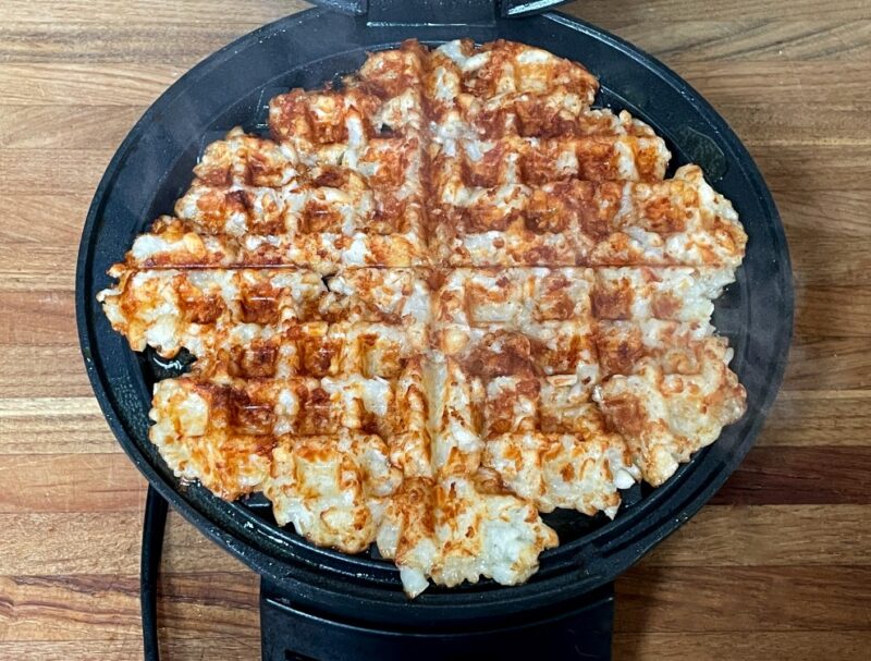 tater tots cooked in a waffle maker