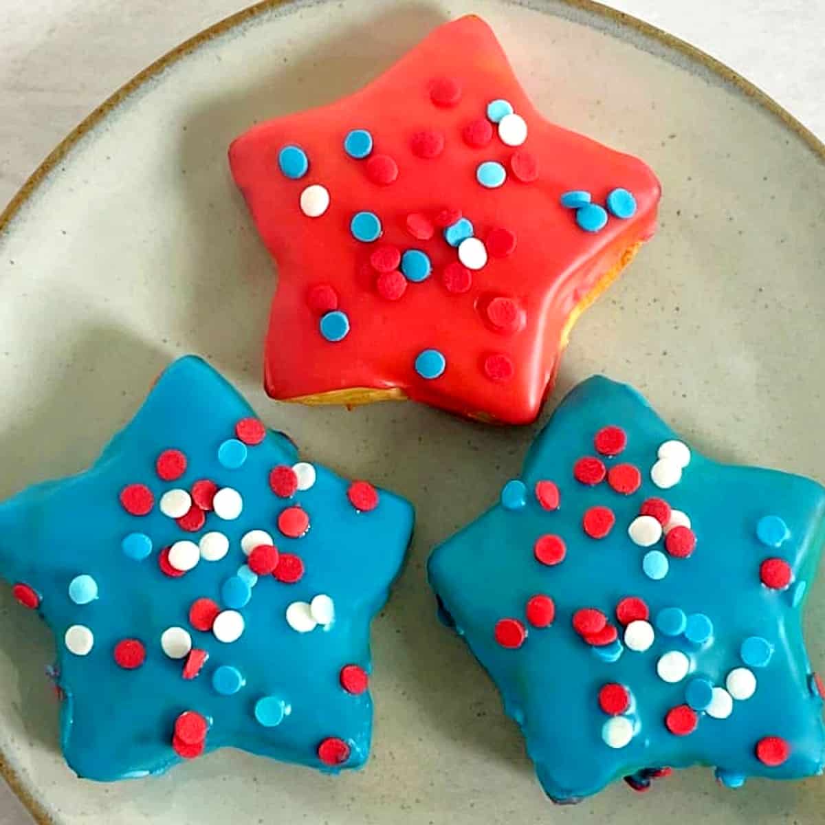 red, white, and blue star donuts on a plate.