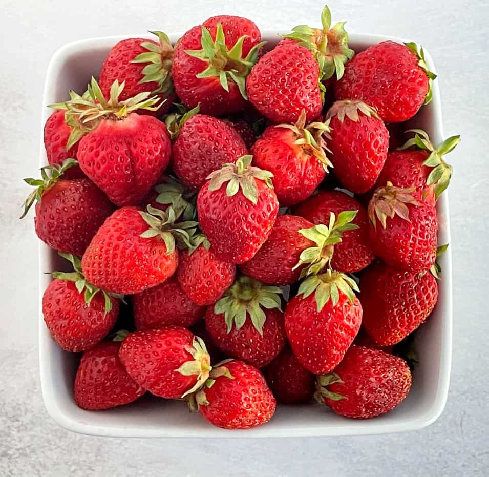 strawberries in a fruit basket.