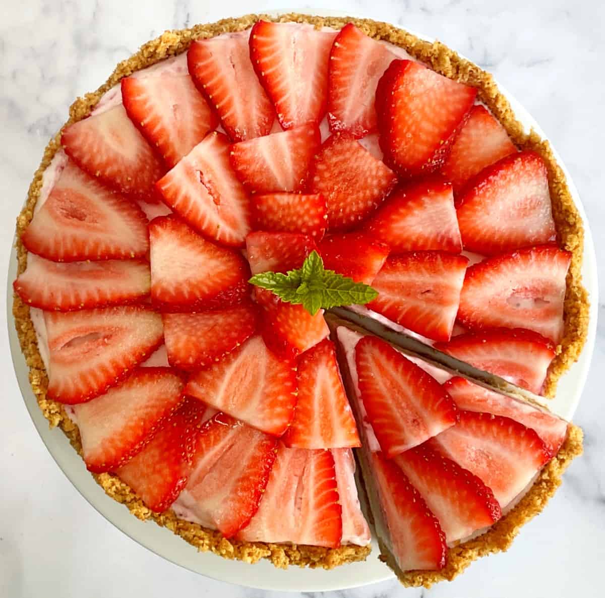 top of strawberry ice cream pie with a slice cut out