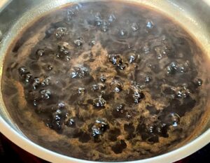 balsamic glaze boiling in a pan