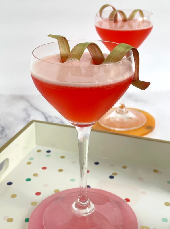 strawberry rhubarb cocktails with rhubarb ribbon garnish