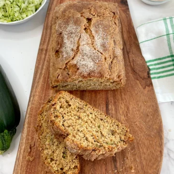 Cinnamon Zucchini bread sliced on a cutting board