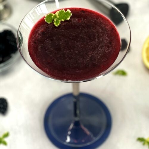 blackberry martini in a martini glass