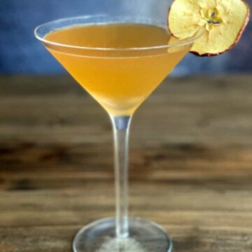 apple cider martini with dehydrated apple garnish