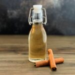 cinnamon syrup in a flip top bottle