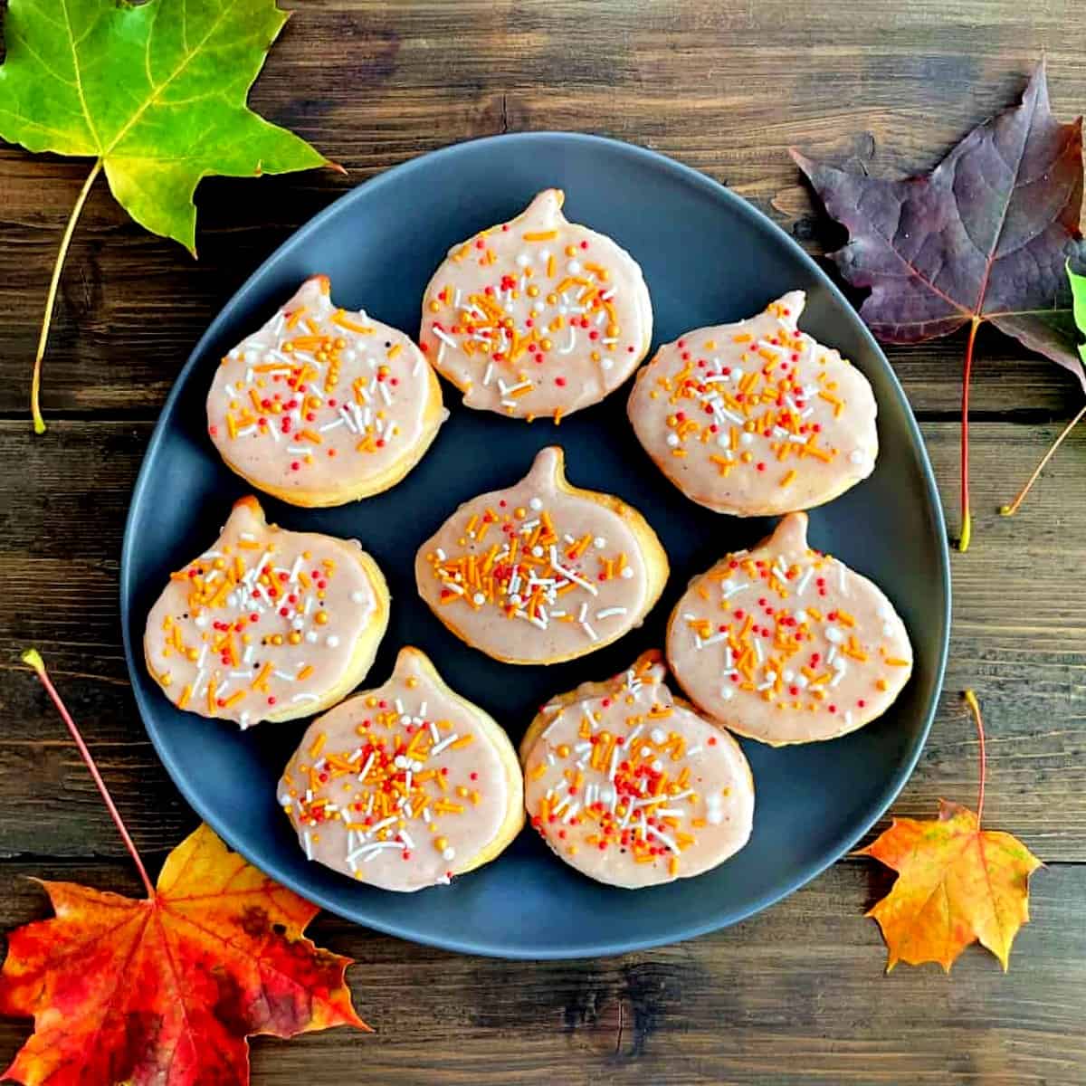 air fryer pumpkin spice donuts with sprinkles.