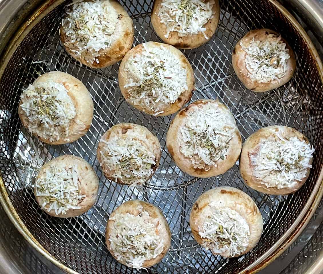 stuffed mushroom in an air fryer before cooking.