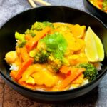 pumpkin curry over rice with cilantro garnish