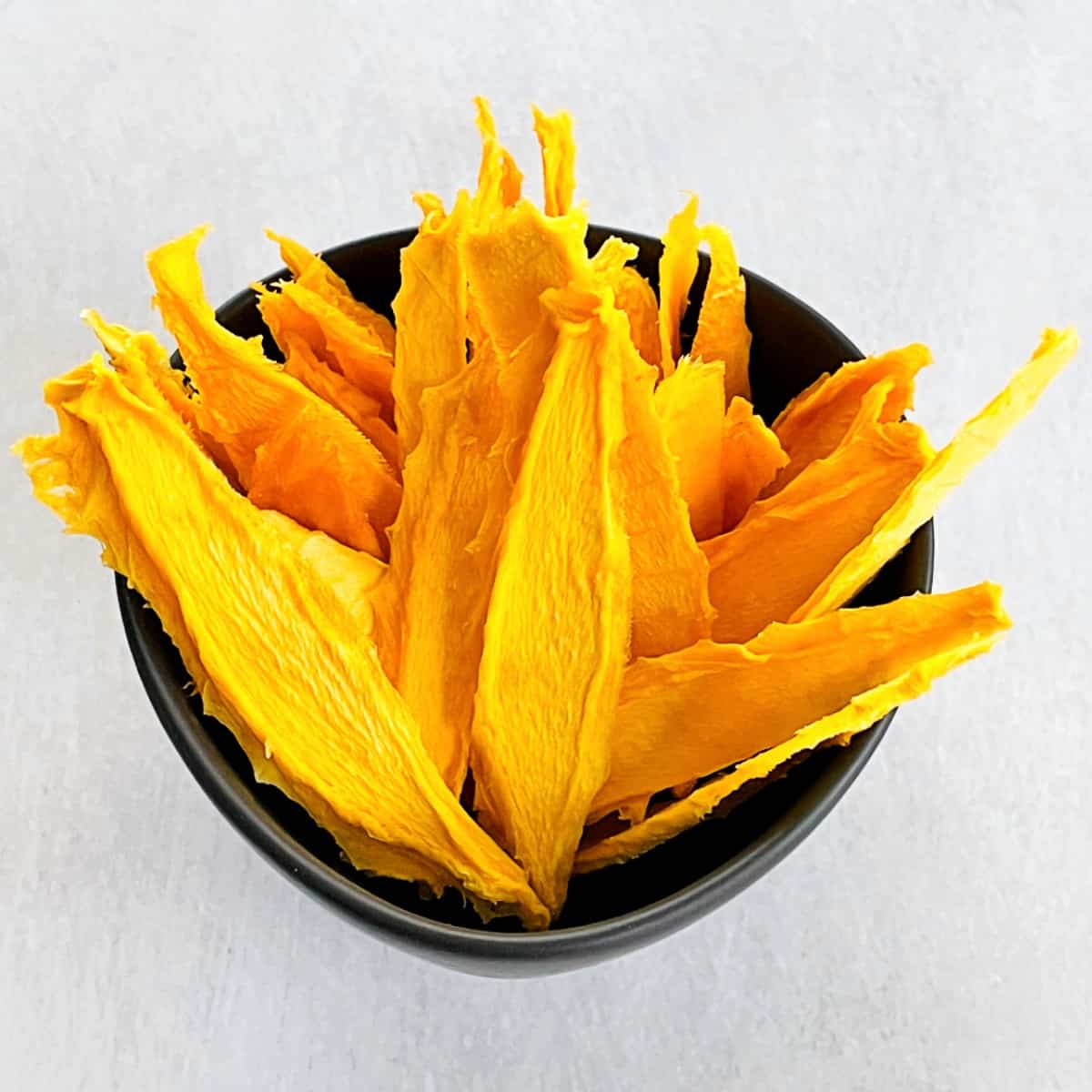 dehydrated mango slices in a bowl
