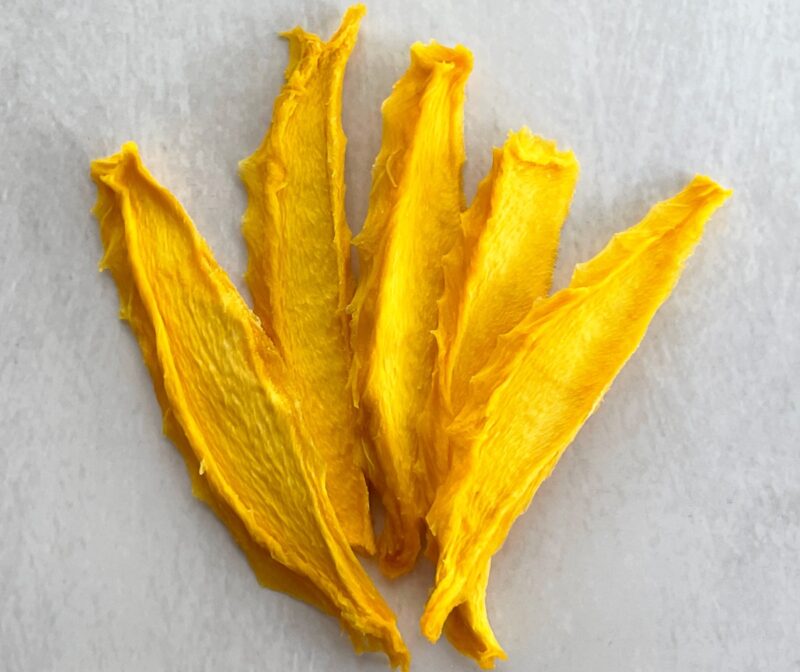 dried mango slices on a table