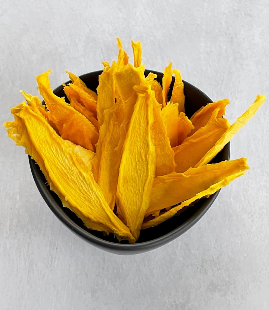 dried mango slices in a bowl.