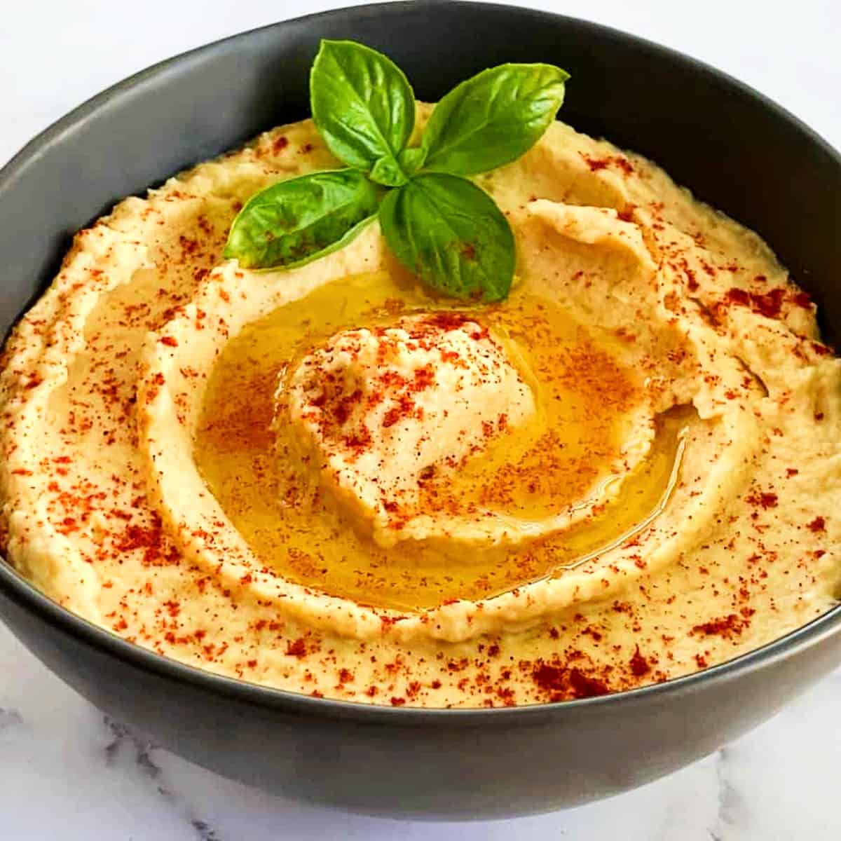 mediterranean hummus with paprika and olive oil.