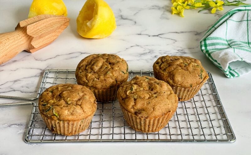 zucchini vegan muffins on a rack.