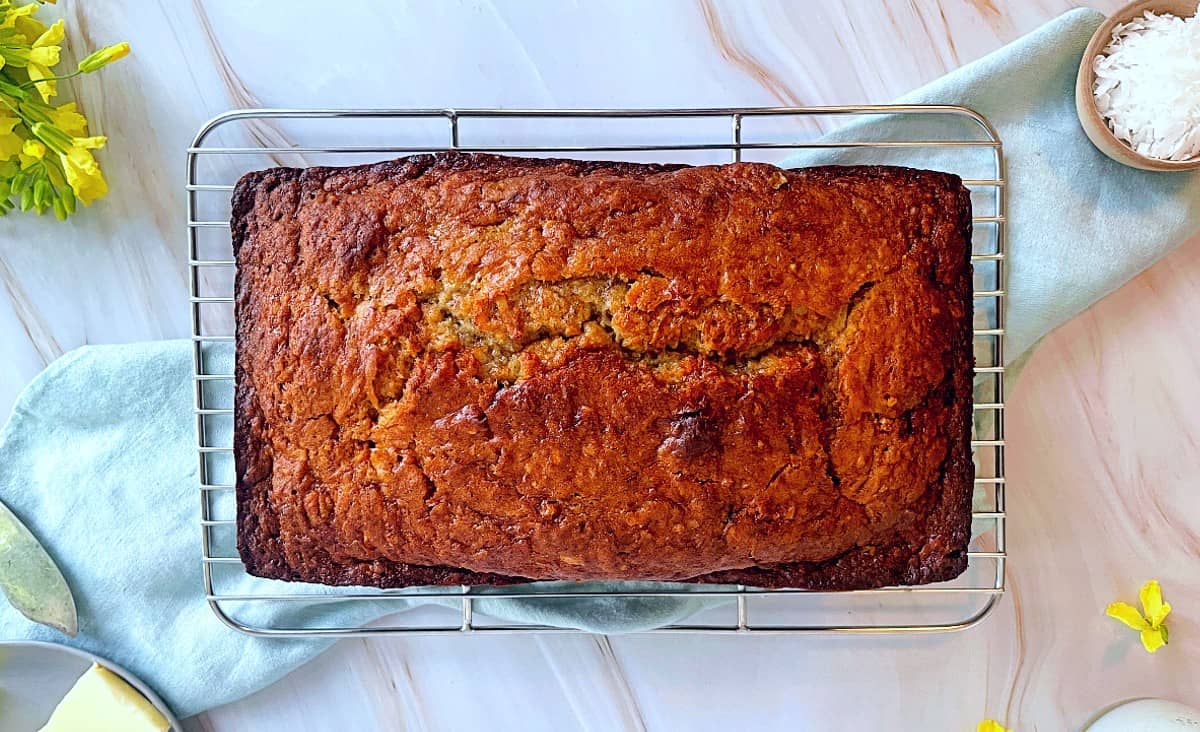 banana bread with coconut milk loaf on a cooling rack