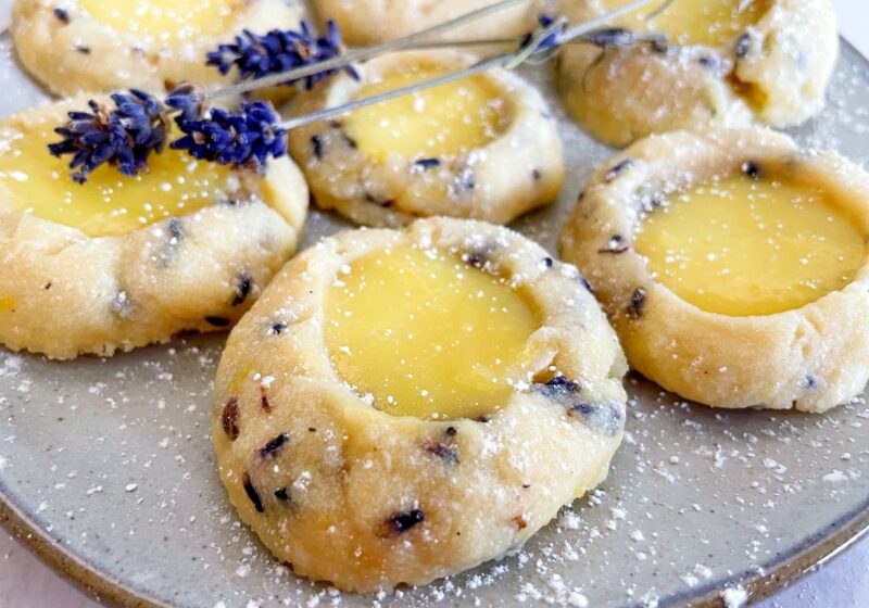lavender lemon curd cookies with a sprinkle of powdered sugar on top