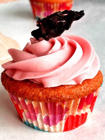 hibiscus cupcake with a dried hibiscus flower on top