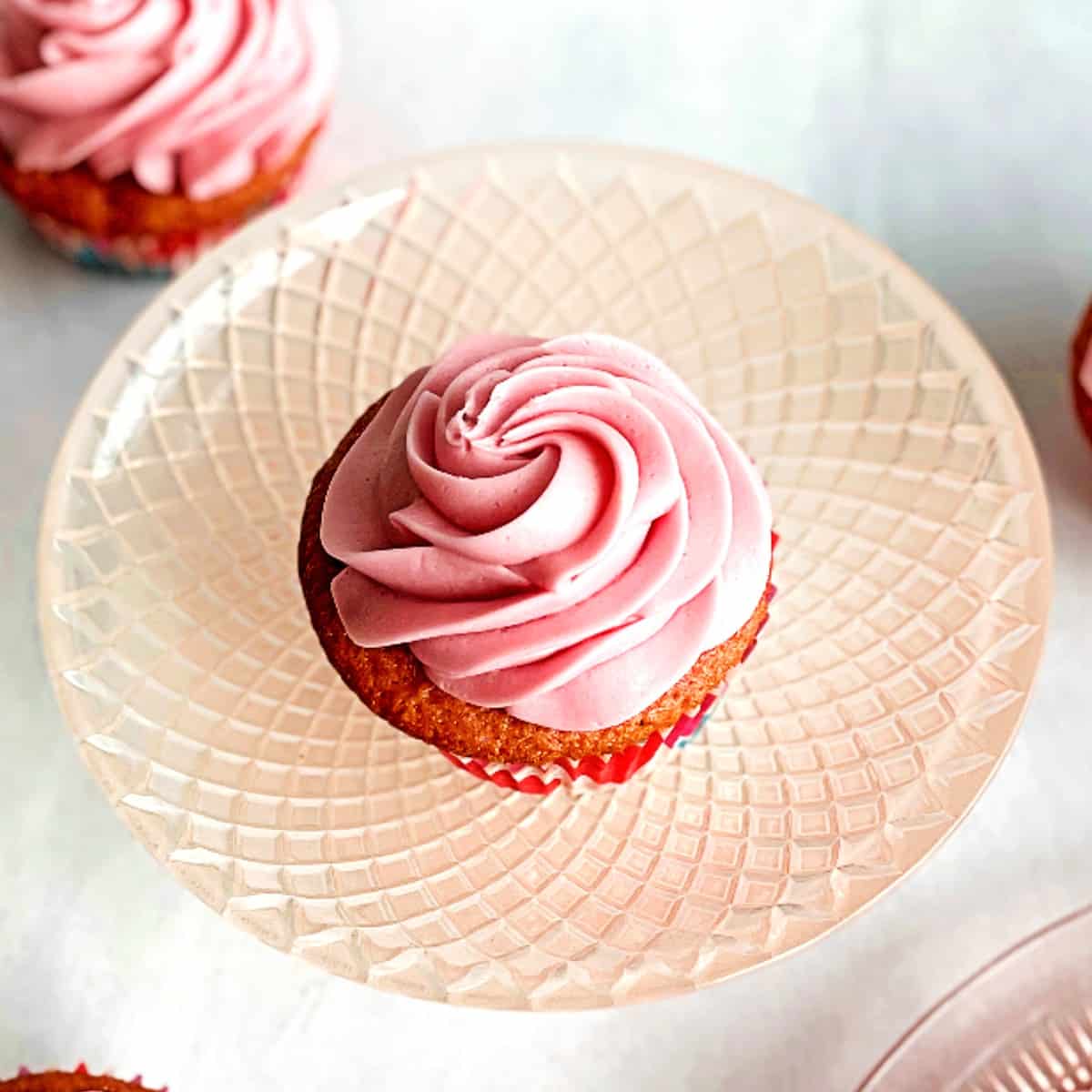 hibiscus cupcake with hibiscus frosting.