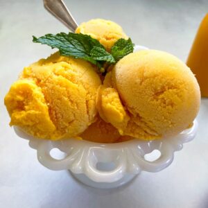 mango gelato with mint garnish