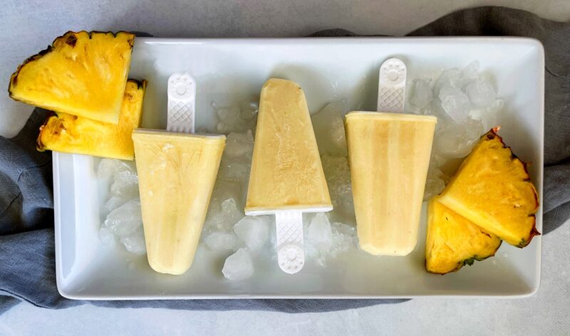 pineapple popsicles on a tray of ice