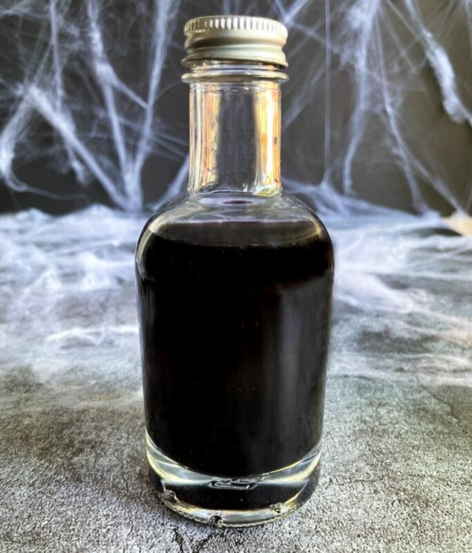 black vodka in a glass bottle.