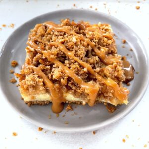 caramel apple cheesecake bar with caramel drizzle