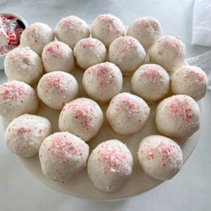 peppermint cake pops on a cake stand