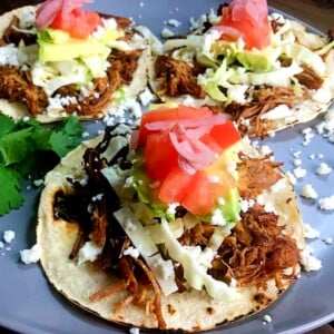 carnitas-tacos-with-vegetable-toppings.