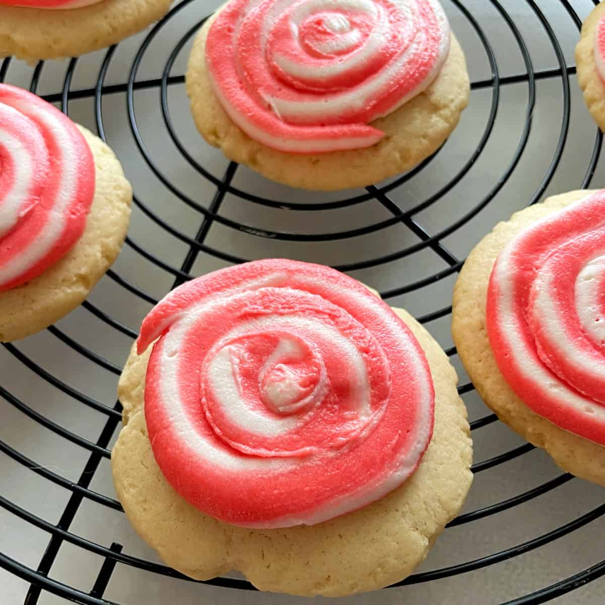 candy cane cookies on a cooling rack.