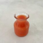 guava puree in a small jar.