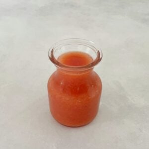 guava puree in a small jar.
