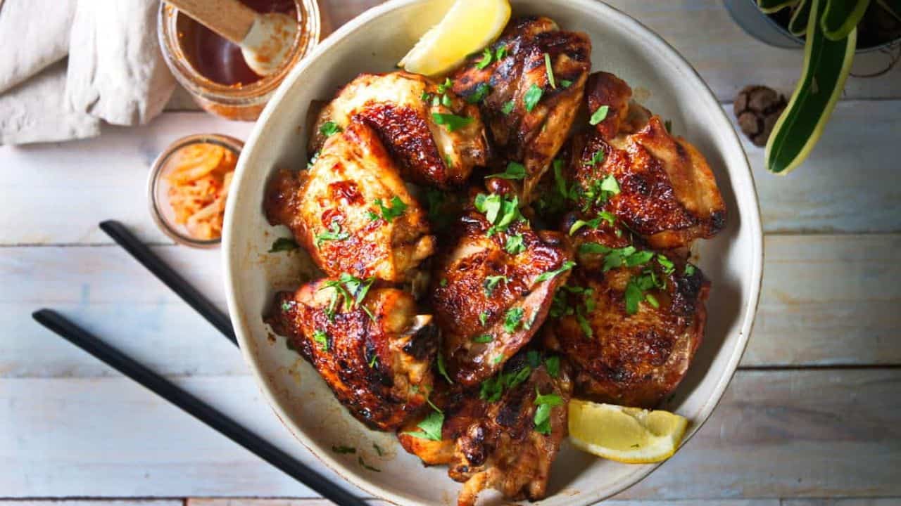 Korean kimchi chicken in a white bowl 