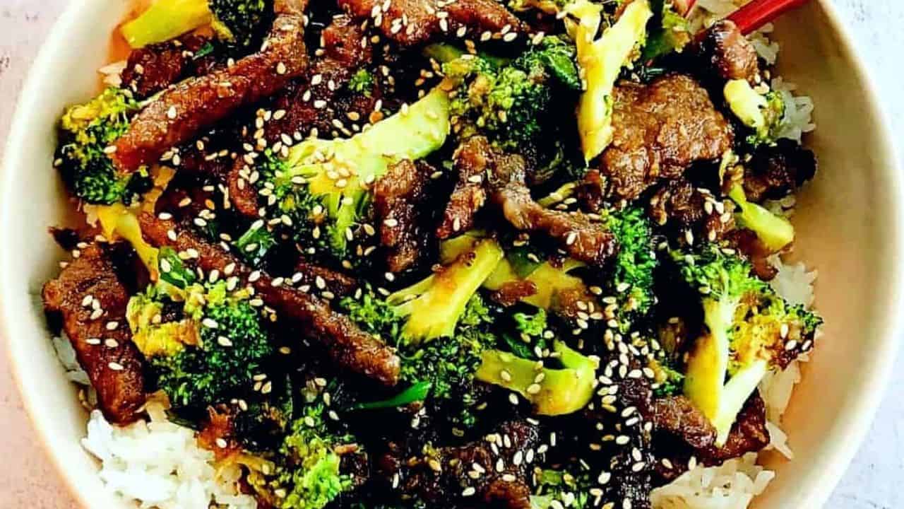 a bowl of sticky beef, broccoli, and rice