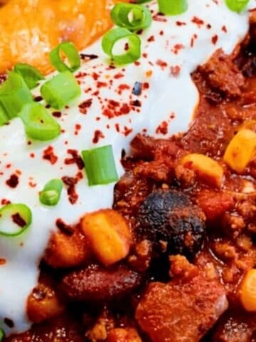 chili recipe in a brown and black bowl