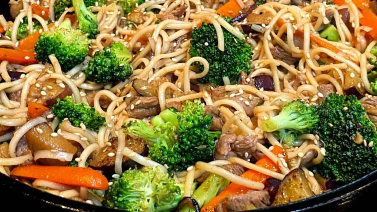 Udon noodle stir fry in a cast iron pan