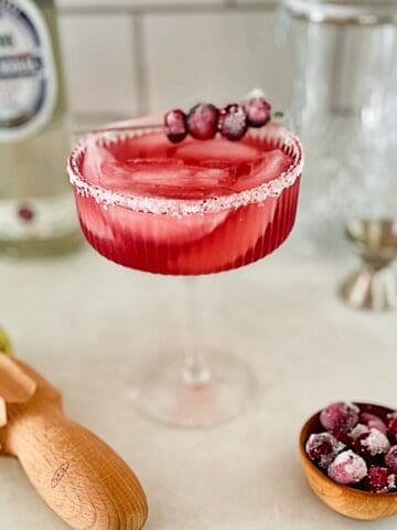 cranberry margarita in a margarita glass.