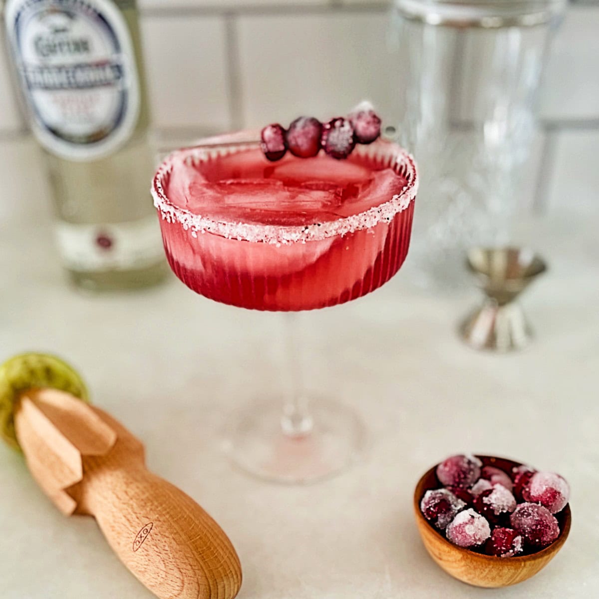 cranberry margarita in a margarita glass.