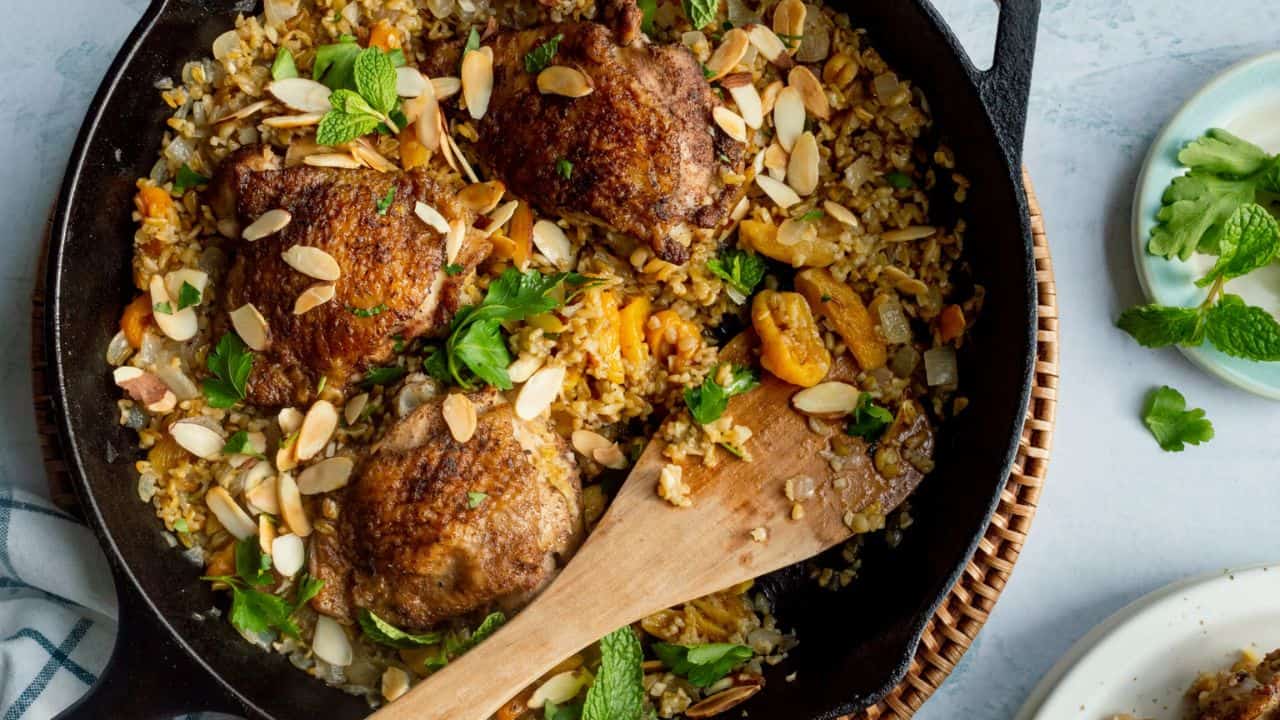 Lebanese Freekeh with Chicken and Apricots in a skillet